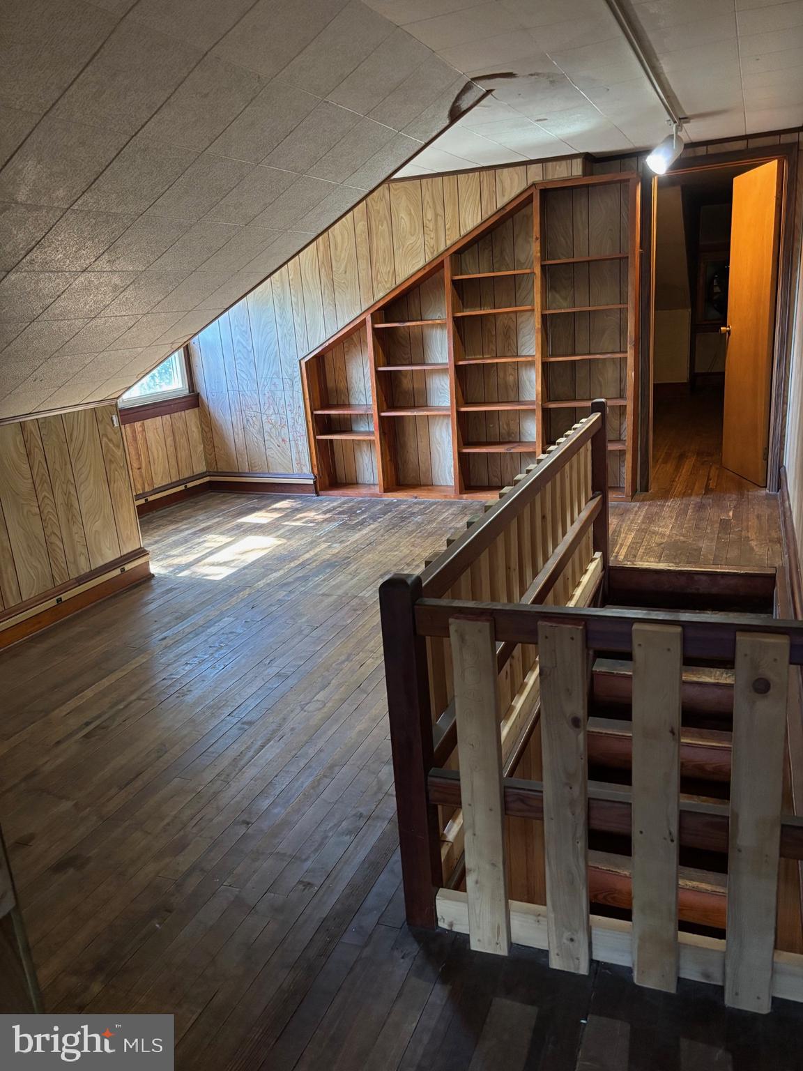 440 North Penn Street Spring City, PA 19475 - Photo 11 of 13 a view of an empty room with wooden floor and stairs