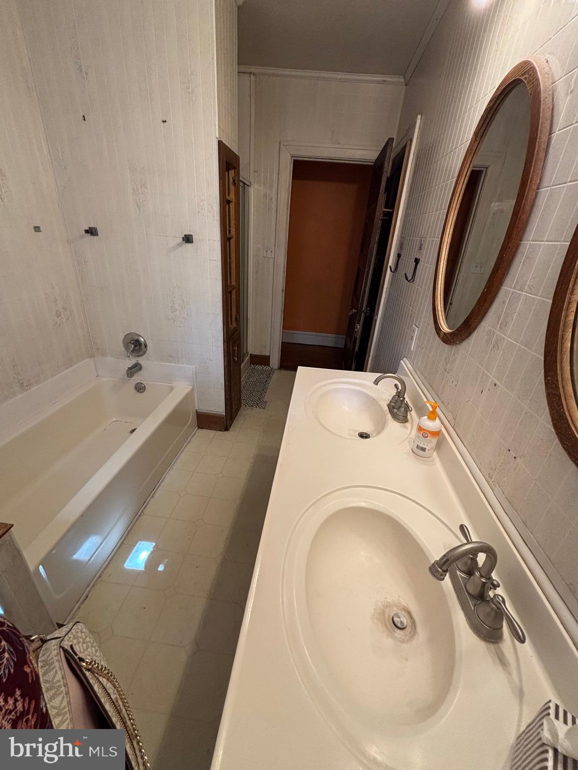 440 North Penn Street Spring City, PA 19475 - Photo 9 of 13 a bathroom with a tub sink and mirror