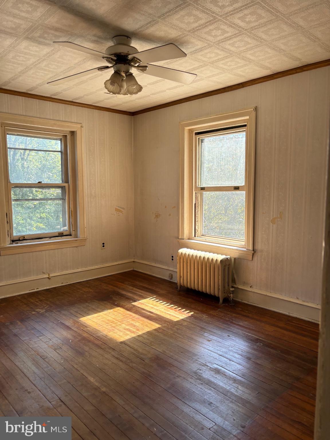 440 North Penn Street Spring City, PA 19475 - Photo 10 of 13 an empty room with wooden floor and windows