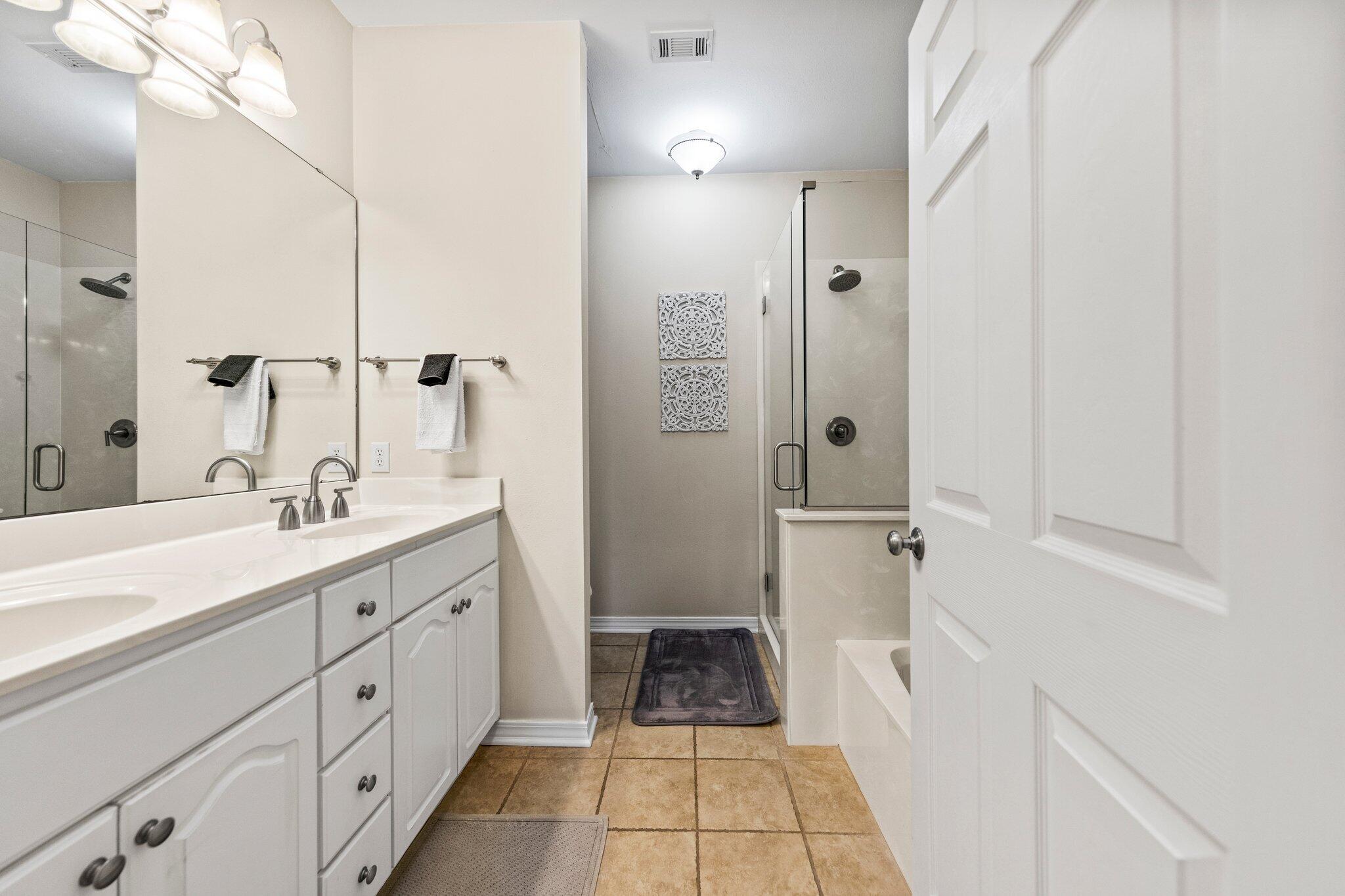 156 Emerald Dunes Circle Santa Rosa Beach, FL 32459 - Photo 12 of 43 a bathroom with a sink a toilet a shower and a mirror