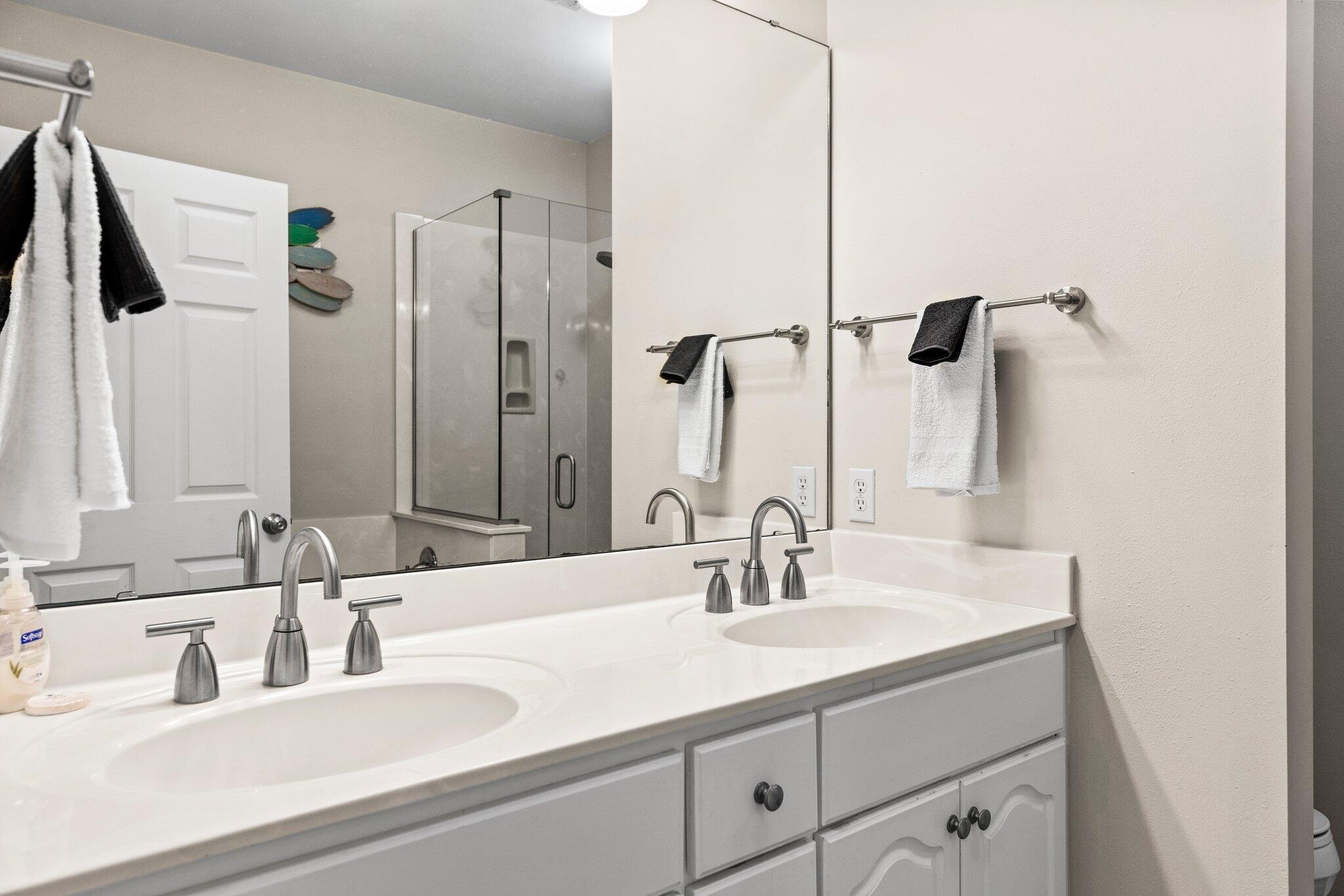 156 Emerald Dunes Circle Santa Rosa Beach, FL 32459 - Photo 13 of 43 a bathroom with double vanity sink a mirror and shower