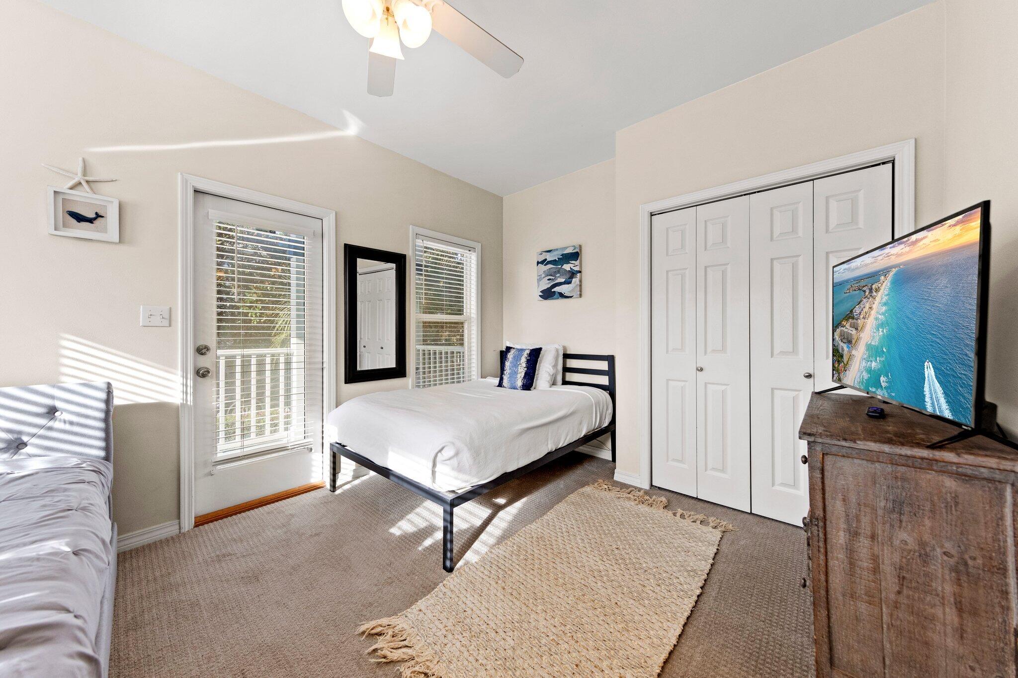 156 Emerald Dunes Circle Santa Rosa Beach, FL 32459 - Photo 16 of 43 a living room with furniture and a flat screen tv