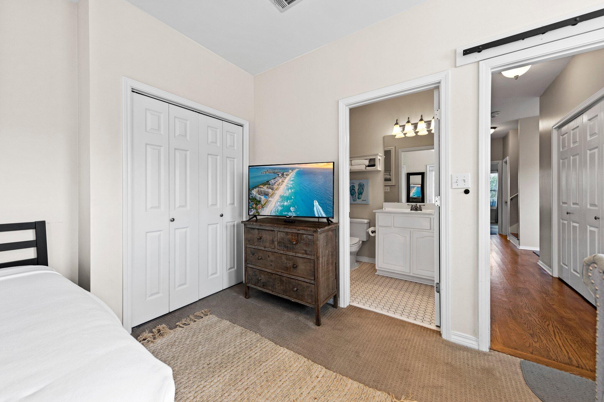 156 Emerald Dunes Circle Santa Rosa Beach, FL 32459 - Photo 17 of 43 a view of a bedroom with furniture and wooden floor