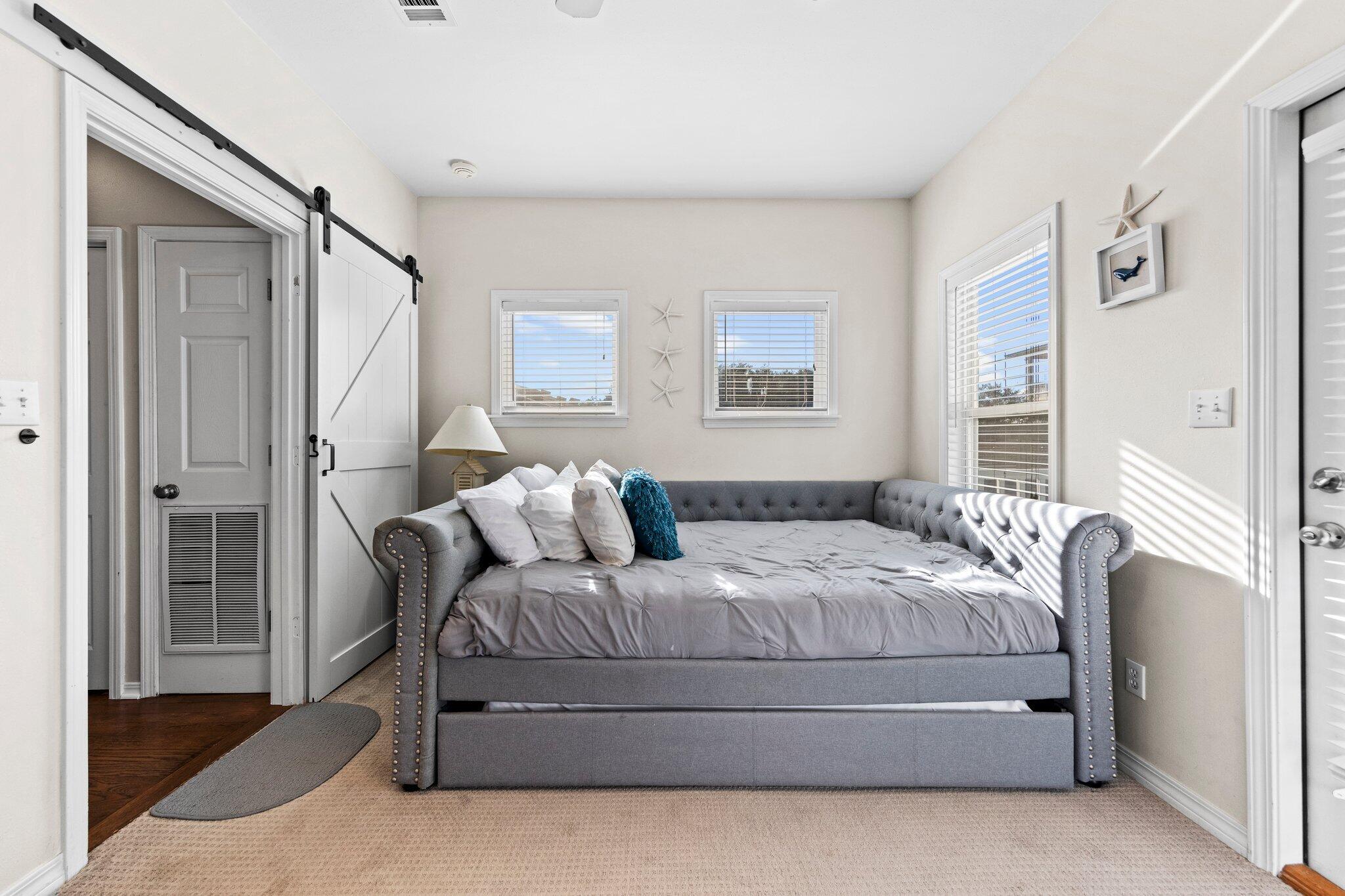 156 Emerald Dunes Circle Santa Rosa Beach, FL 32459 - Photo 18 of 43 a bedroom with a bed window and a walk in closet