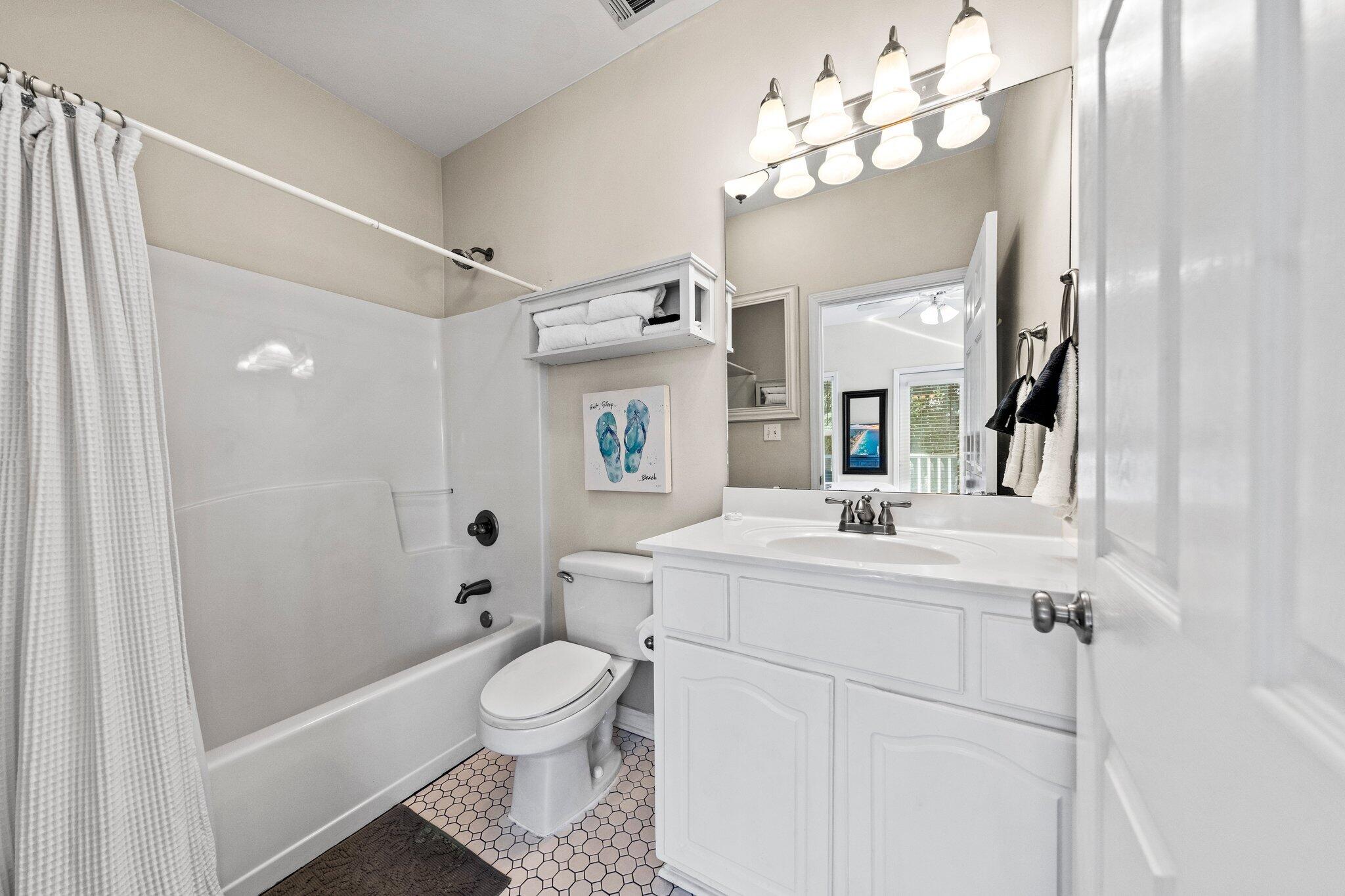 156 Emerald Dunes Circle Santa Rosa Beach, FL 32459 - Photo 19 of 43 a bathroom with a sink toilet mirror and shower