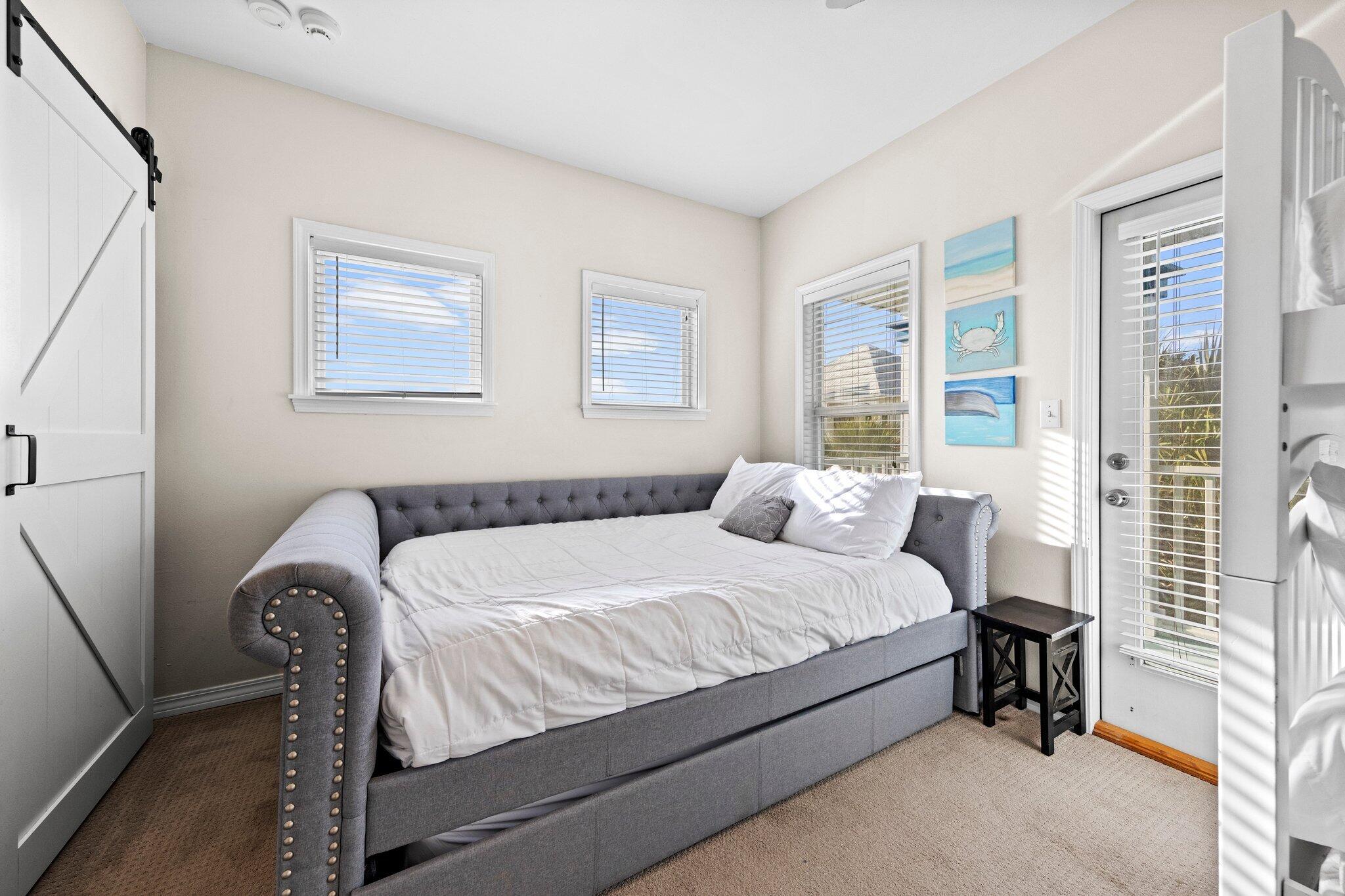 156 Emerald Dunes Circle Santa Rosa Beach, FL 32459 - Photo 21 of 43 a bedroom with a bed and a window