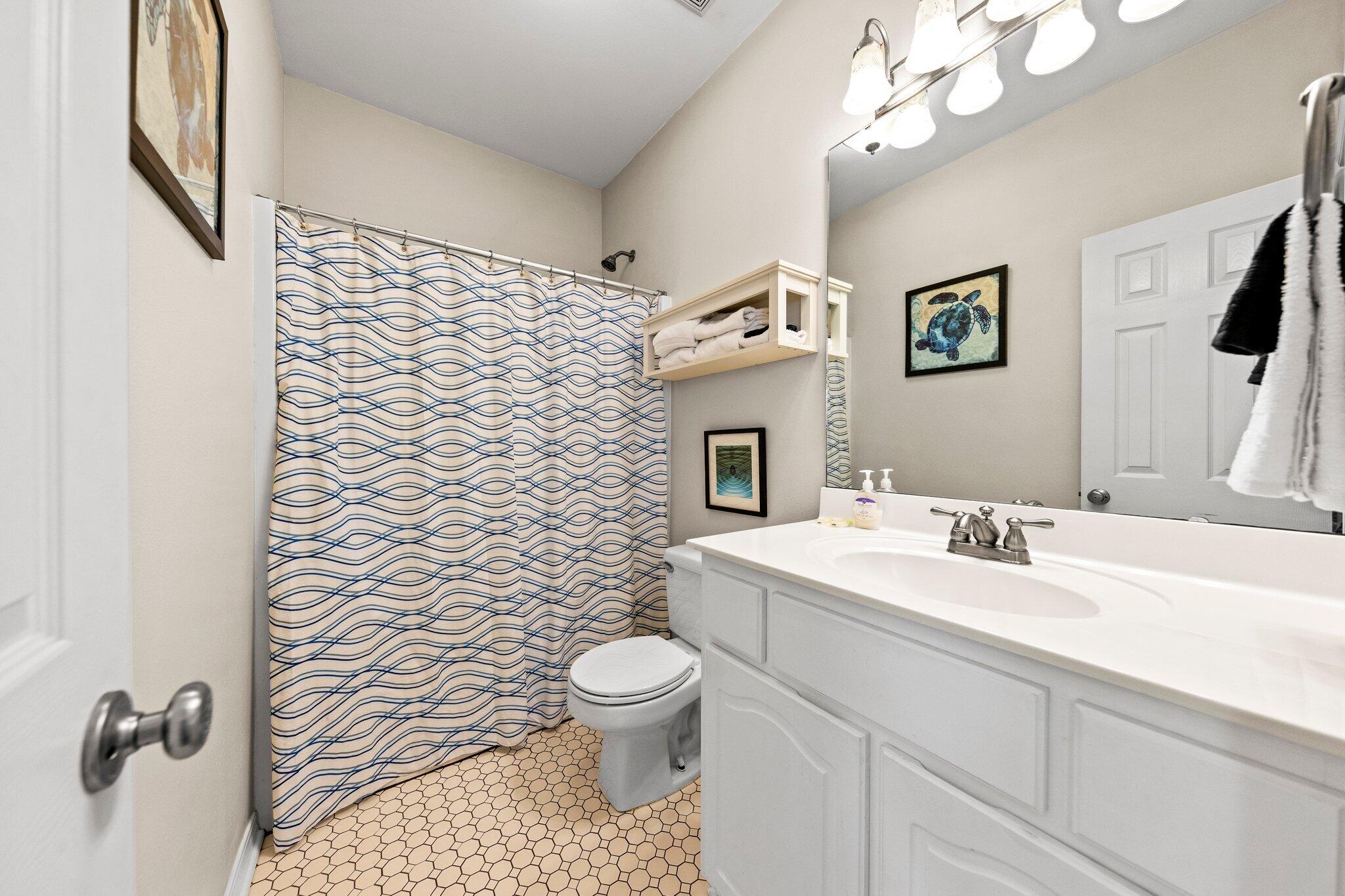 156 Emerald Dunes Circle Santa Rosa Beach, FL 32459 - Photo 22 of 43 a bathroom with a toilet sink and mirror