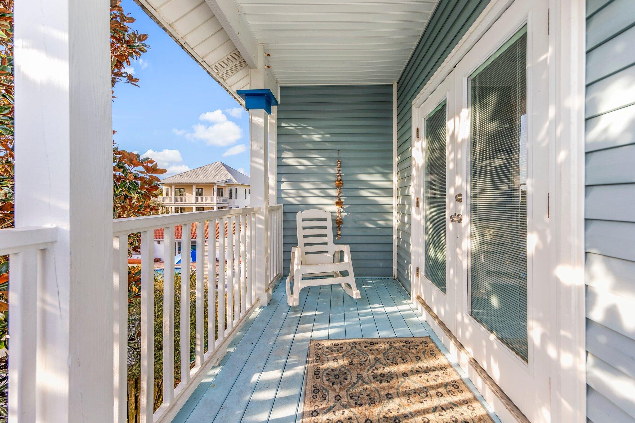 156 Emerald Dunes Circle Santa Rosa Beach, FL 32459 - Photo 23 of 43 a view of a balcony with wooden floor