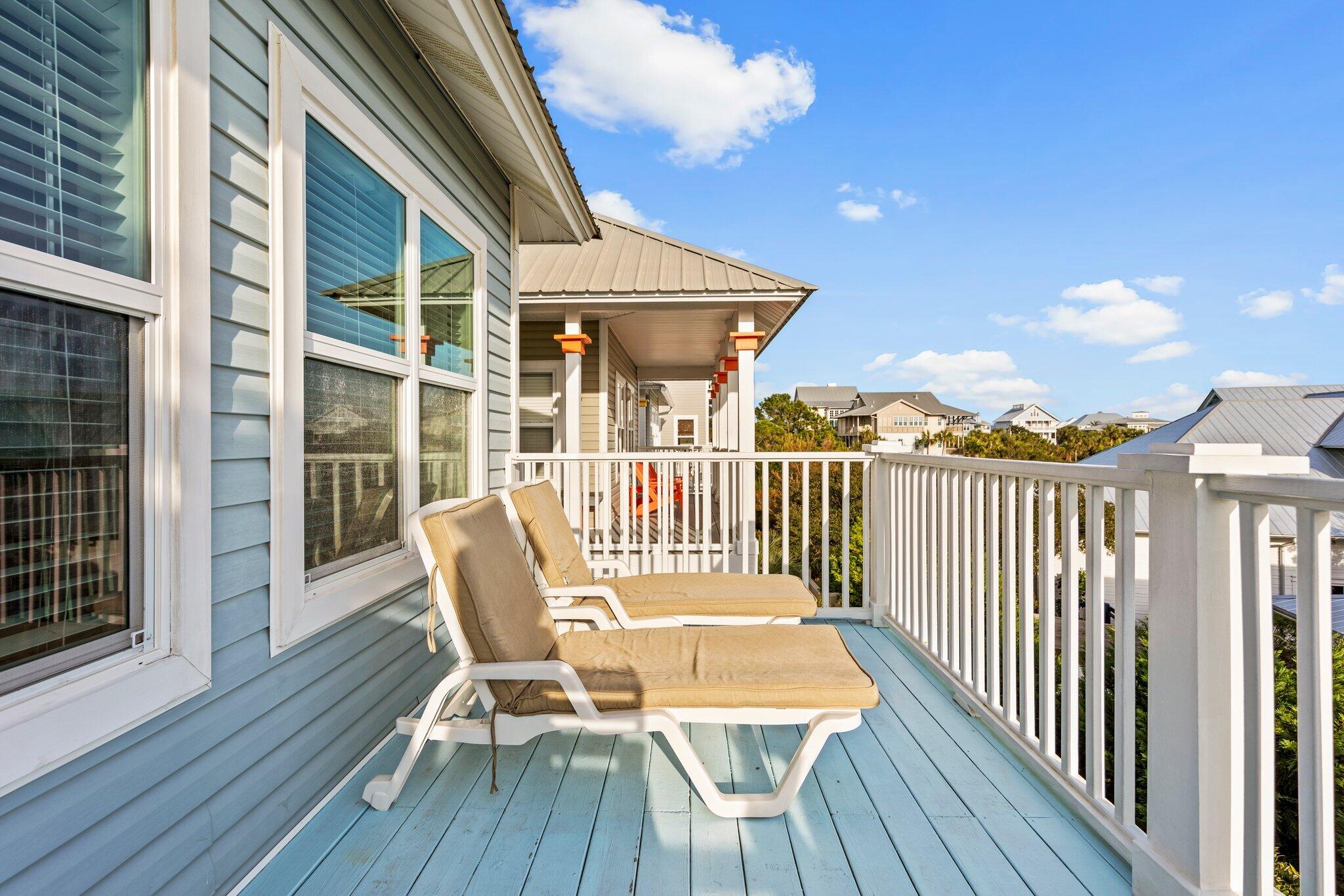 156 Emerald Dunes Circle Santa Rosa Beach, FL 32459 - Photo 25 of 43 a view of a chair and table on the deck
