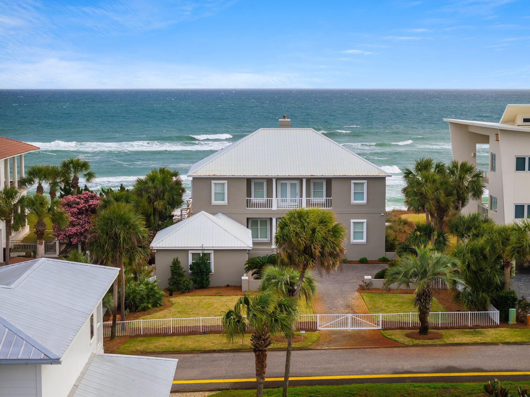 156 Emerald Dunes Circle Santa Rosa Beach, FL 32459 - Photo 27 of 43 a front view of a house with garden