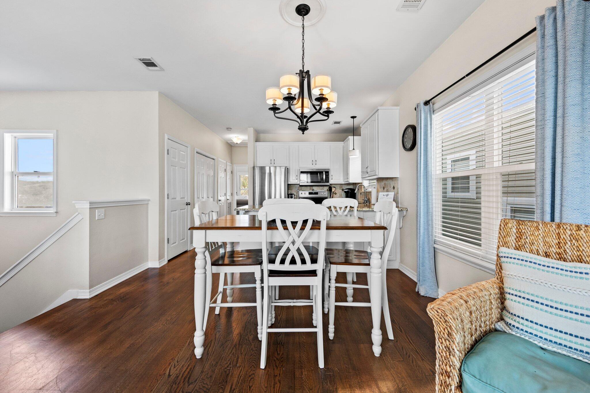 156 Emerald Dunes Circle Santa Rosa Beach, FL 32459 - Photo 5 of 43 a view of a dining room with furniture window and wooden floor