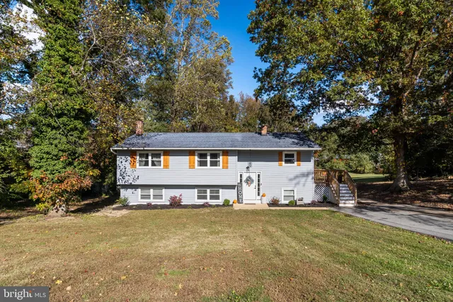 a house that has a tree in front of it
