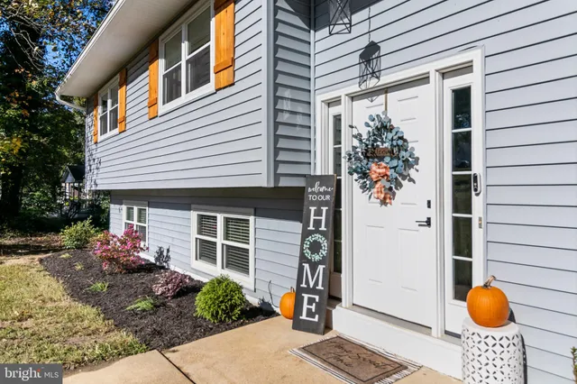 a front view of a house with an outdoor seating