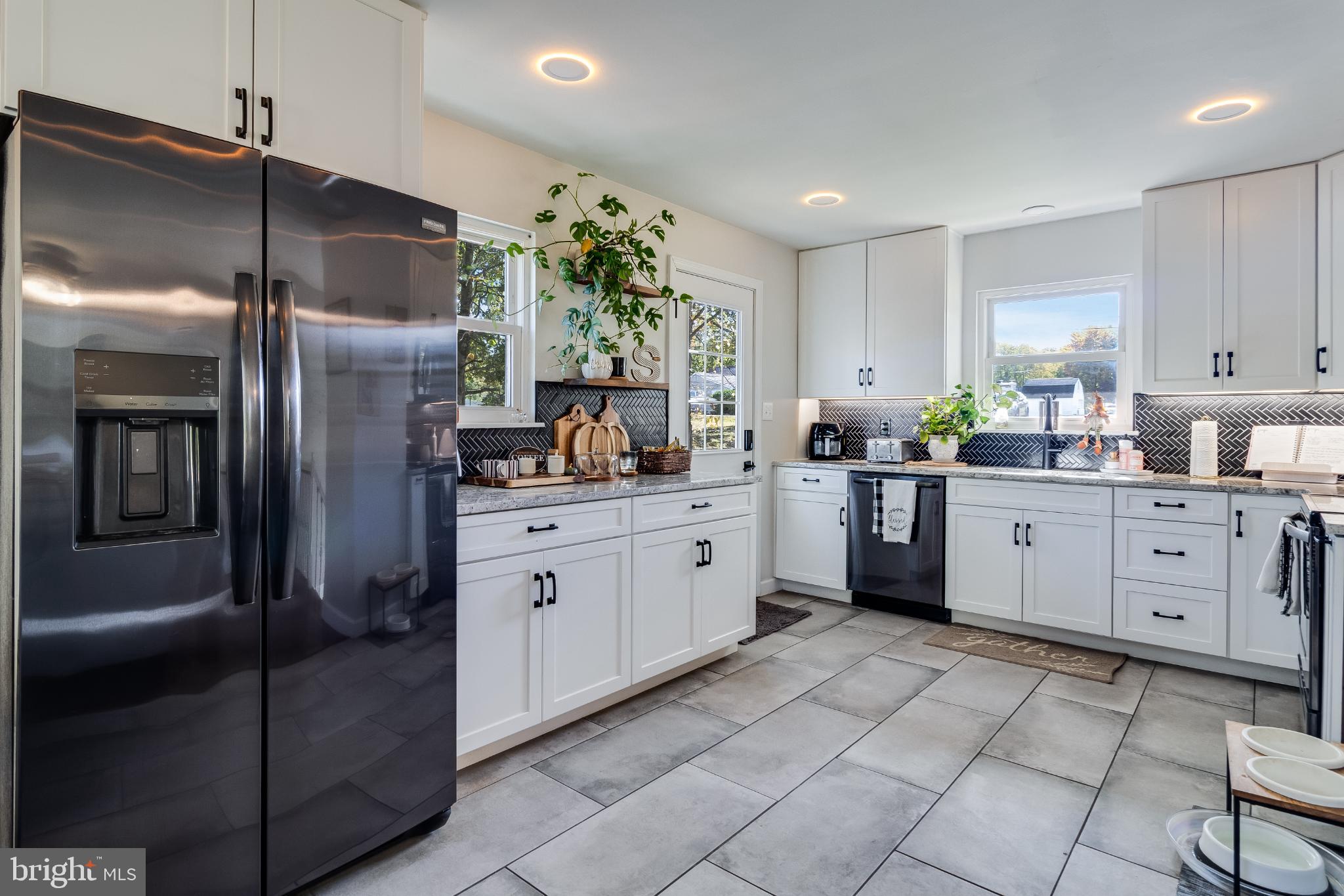 Modern kitchen with sleek finishes and light.