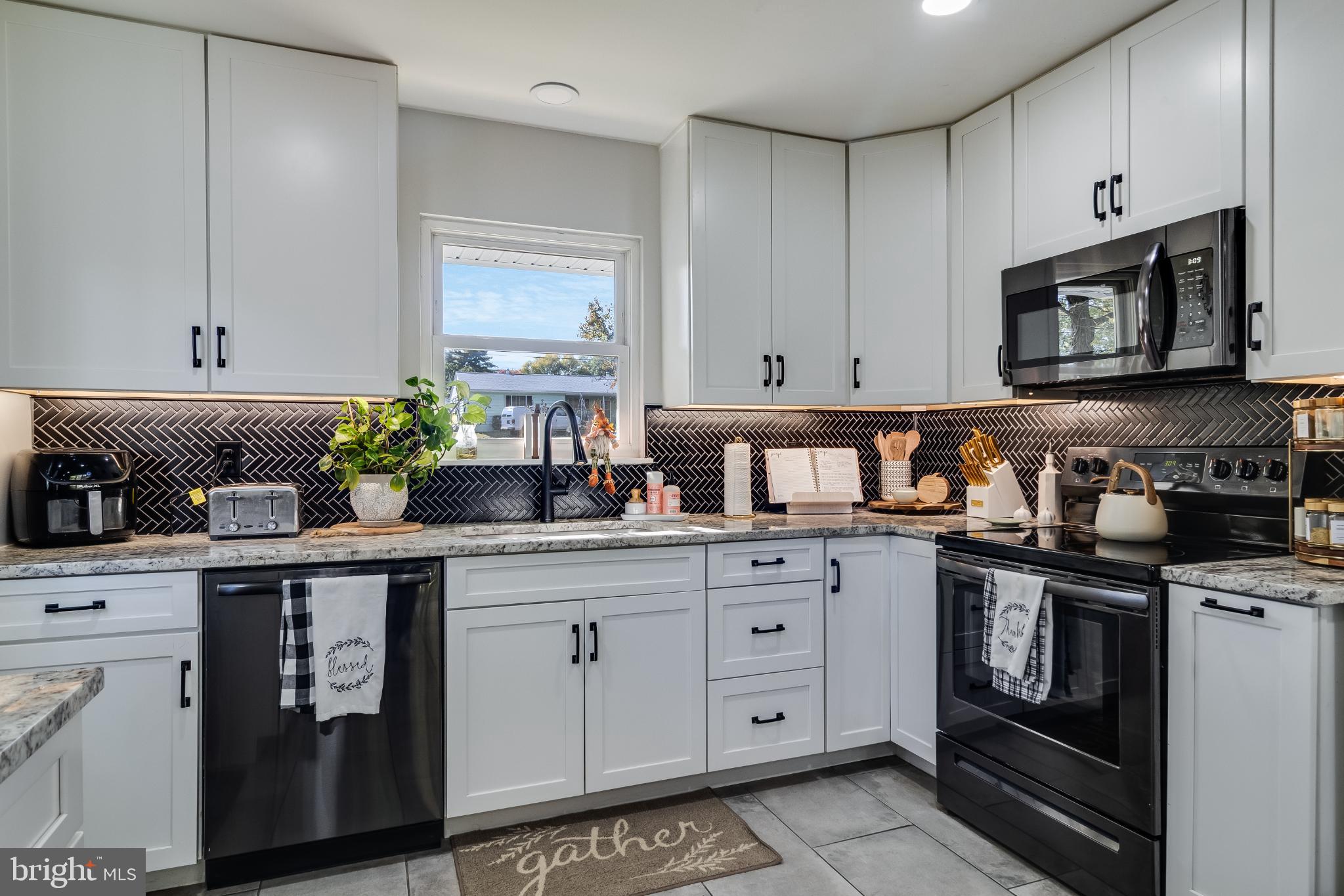 Modern kitchen with sleek finishes and charm.