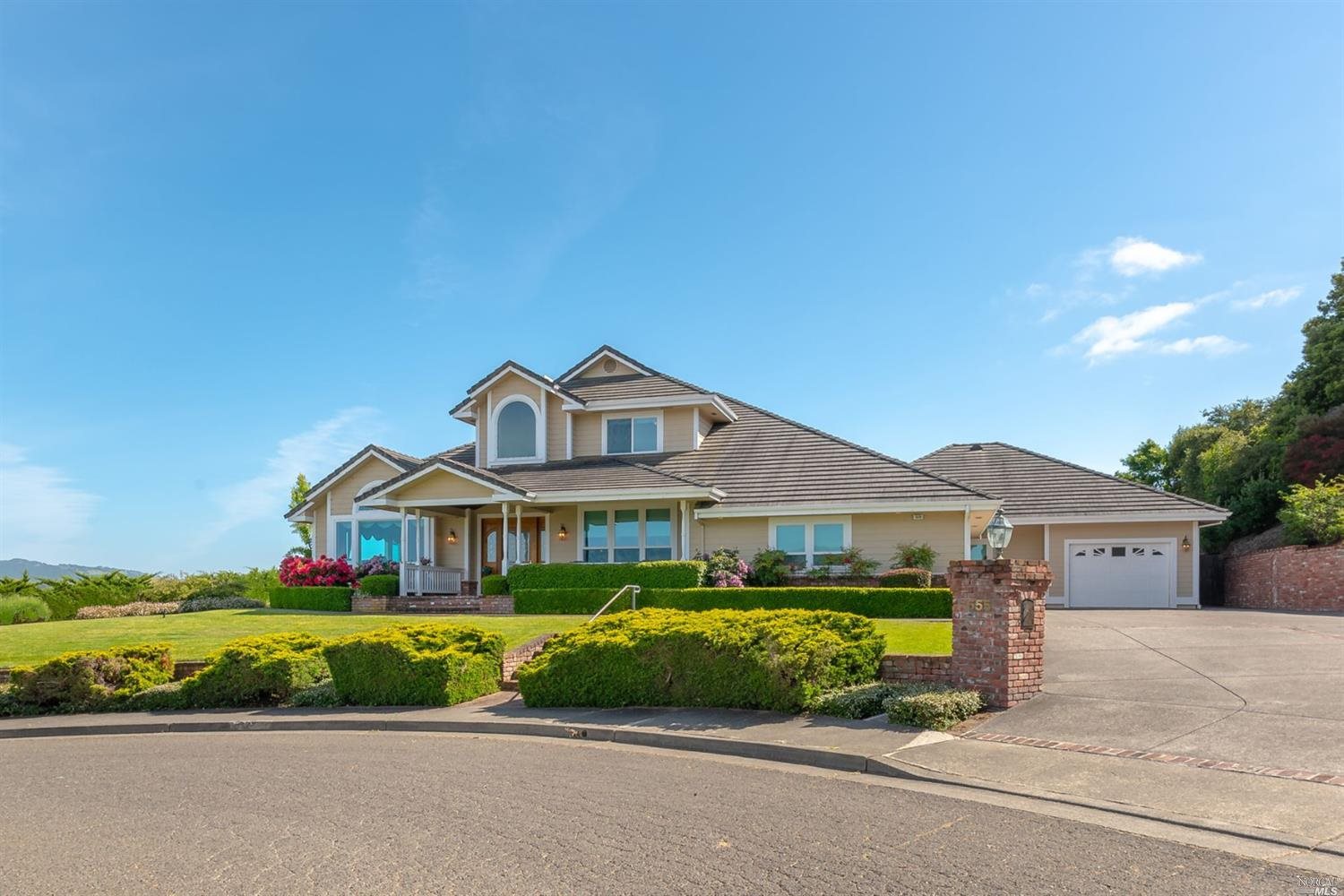 555 Hayes Lane Petaluma, CA 94952 - Photo 1 of 1 a front view of a house with a garden and parking