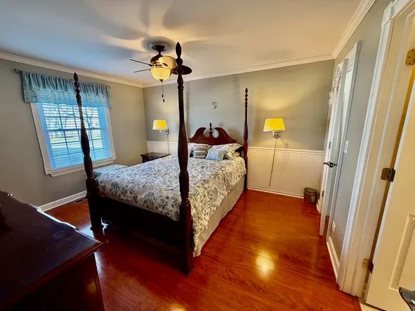 a bed room with a bed and a window