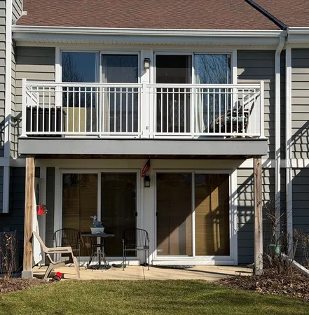 a view of a house with swimming pool and porch