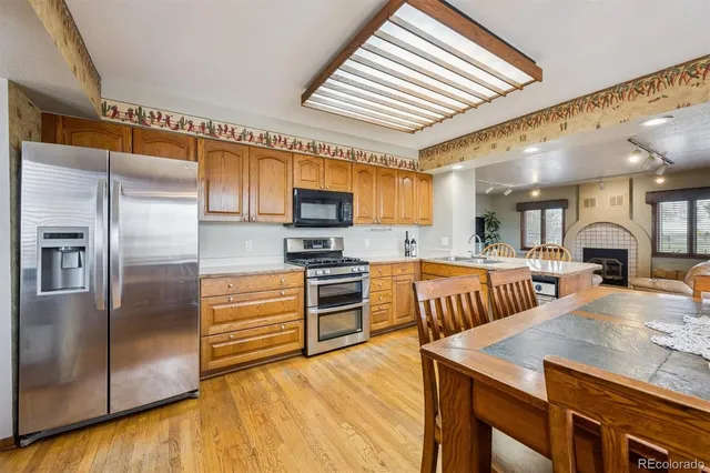 a kitchen with cabinets and stainless steel appliances