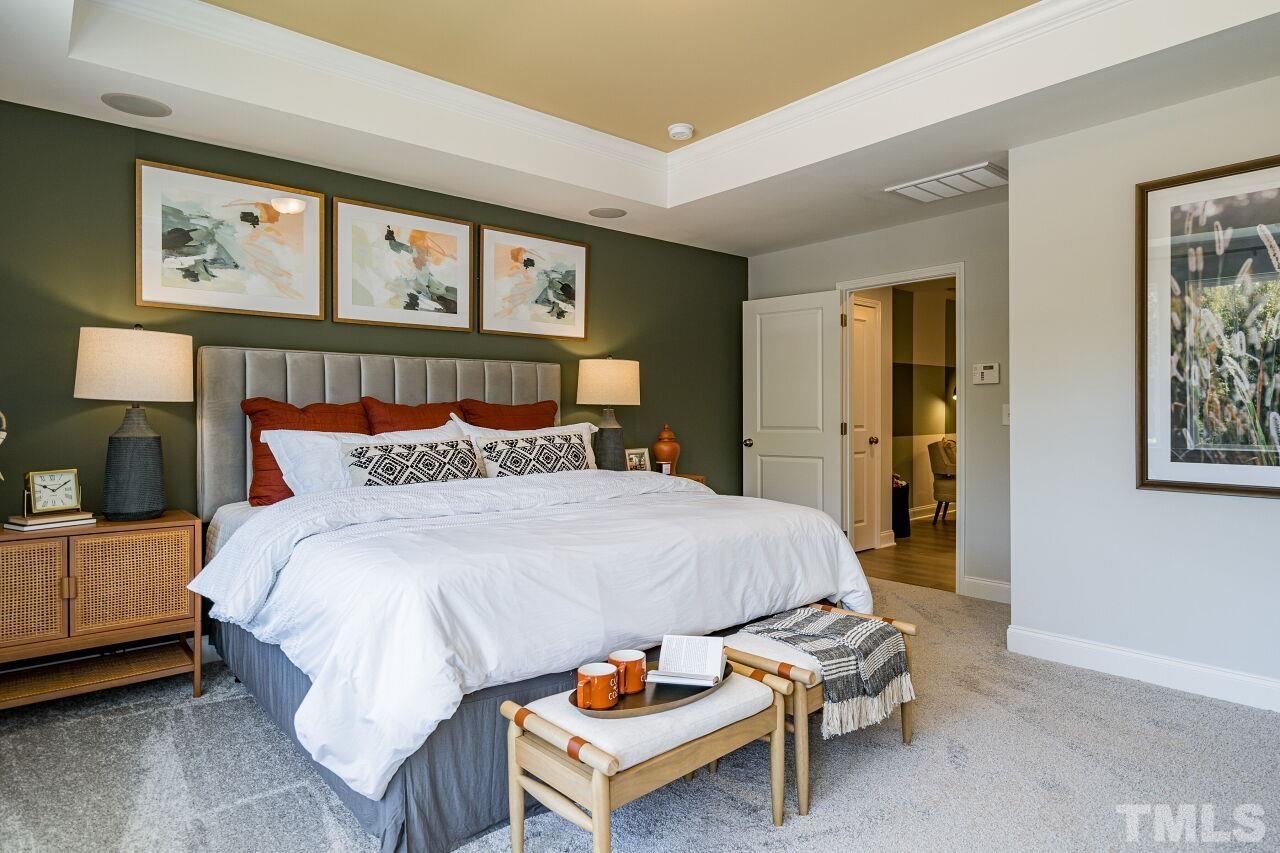 3115 Dunnock Drive, Unit 2 Durham, NC 27713 - Photo 13 of 24 a bed room with a bed and a tv