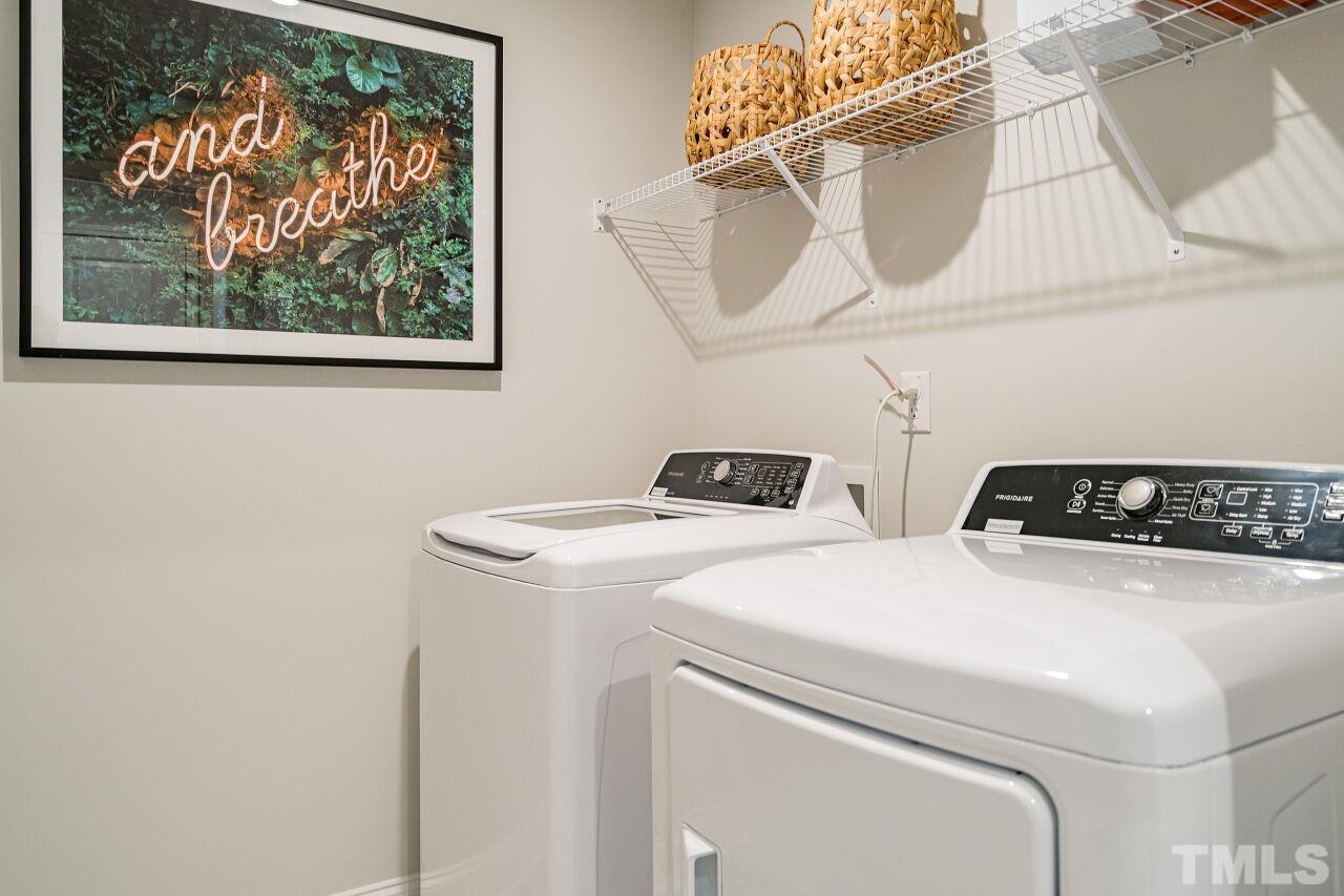 3115 Dunnock Drive, Unit 2 Durham, NC 27713 - Photo 16 of 24 a utility room with dryer and washer