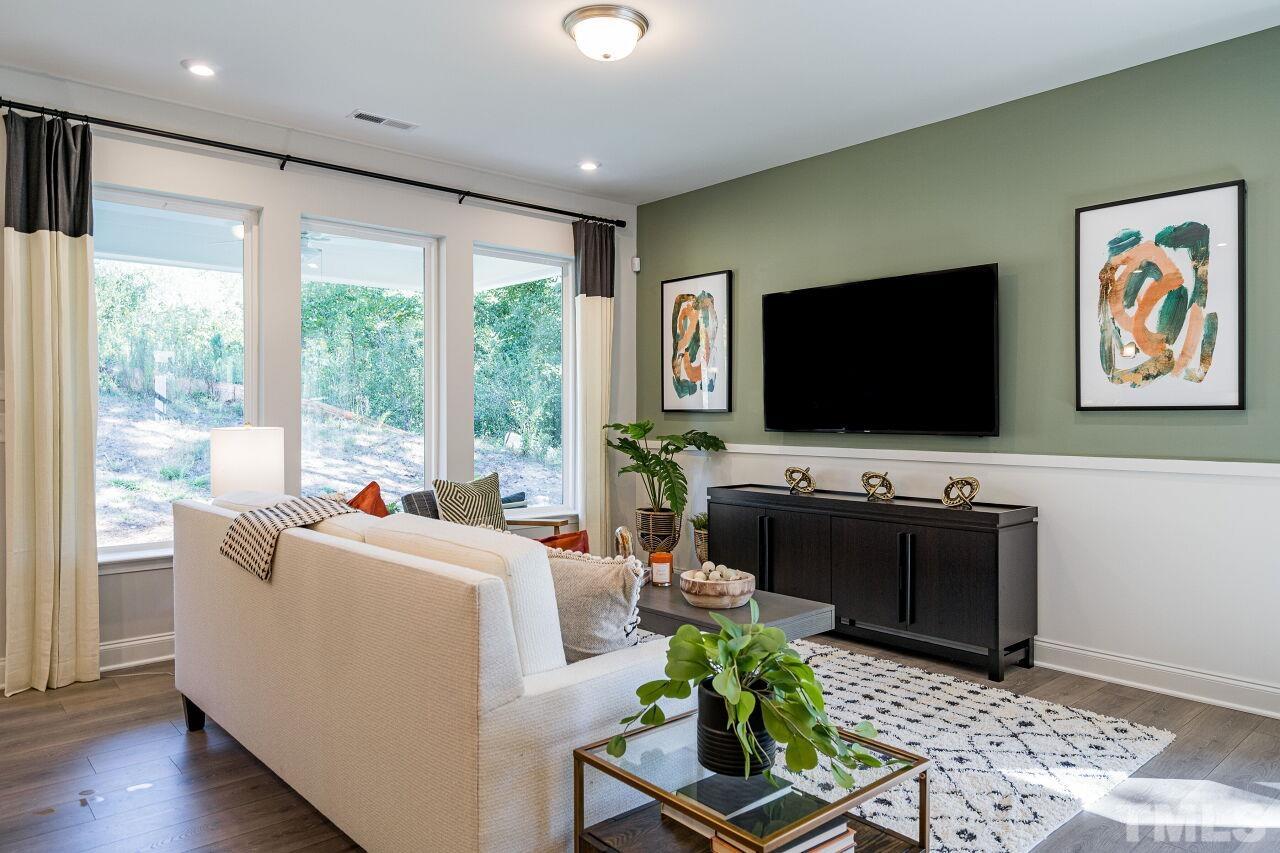 3115 Dunnock Drive, Unit 2 Durham, NC 27713 - Photo 2 of 24 a living room with furniture and a flat screen tv