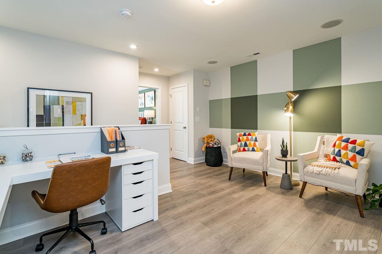 3115 Dunnock Drive, Unit 2 Durham, NC 27713 - Photo 22 of 24 a living room with furniture and a wooden floor