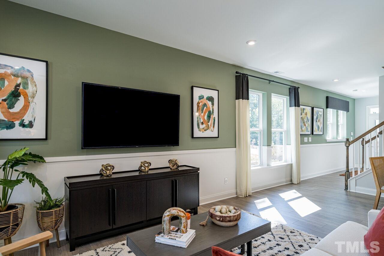 3115 Dunnock Drive, Unit 2 Durham, NC 27713 - Photo 3 of 24 a living room with furniture and a flat screen tv