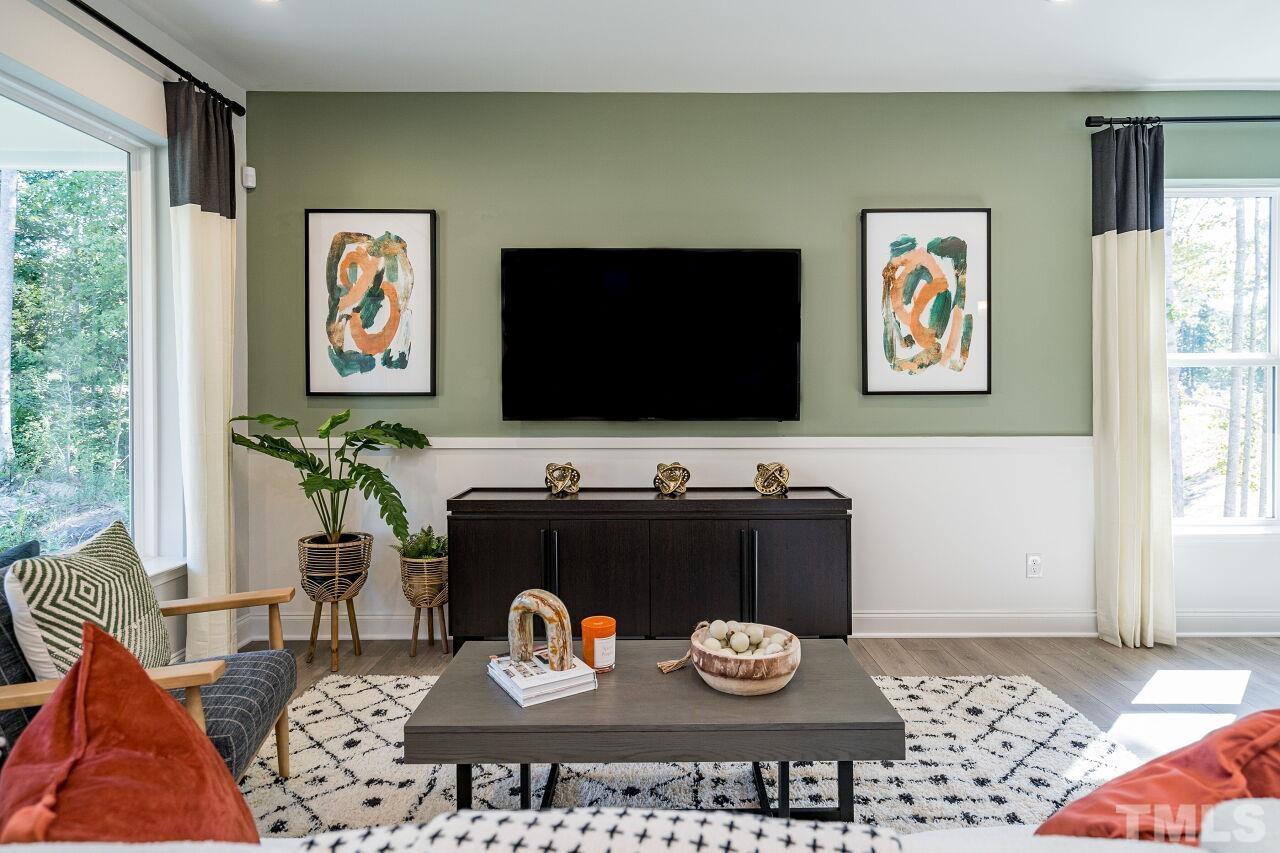 3115 Dunnock Drive, Unit 2 Durham, NC 27713 - Photo 5 of 24 a living room with furniture and a flat screen tv