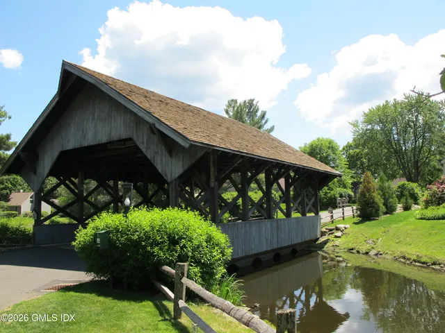 a view of tennis court with trees in the background