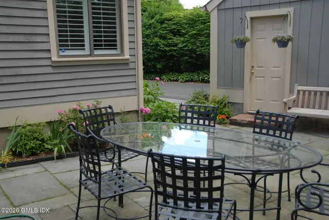 a kitchen with kitchen island a sink stainless steel appliances and cabinets