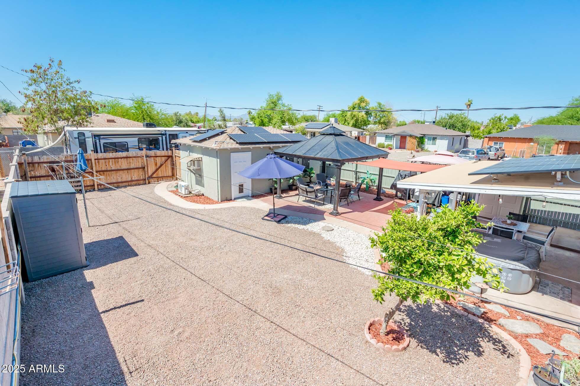 2221 West Mitchell Drive Phoenix, AZ 85015 - Photo 9 of 45 a view of a patio with table and chairs potted plants