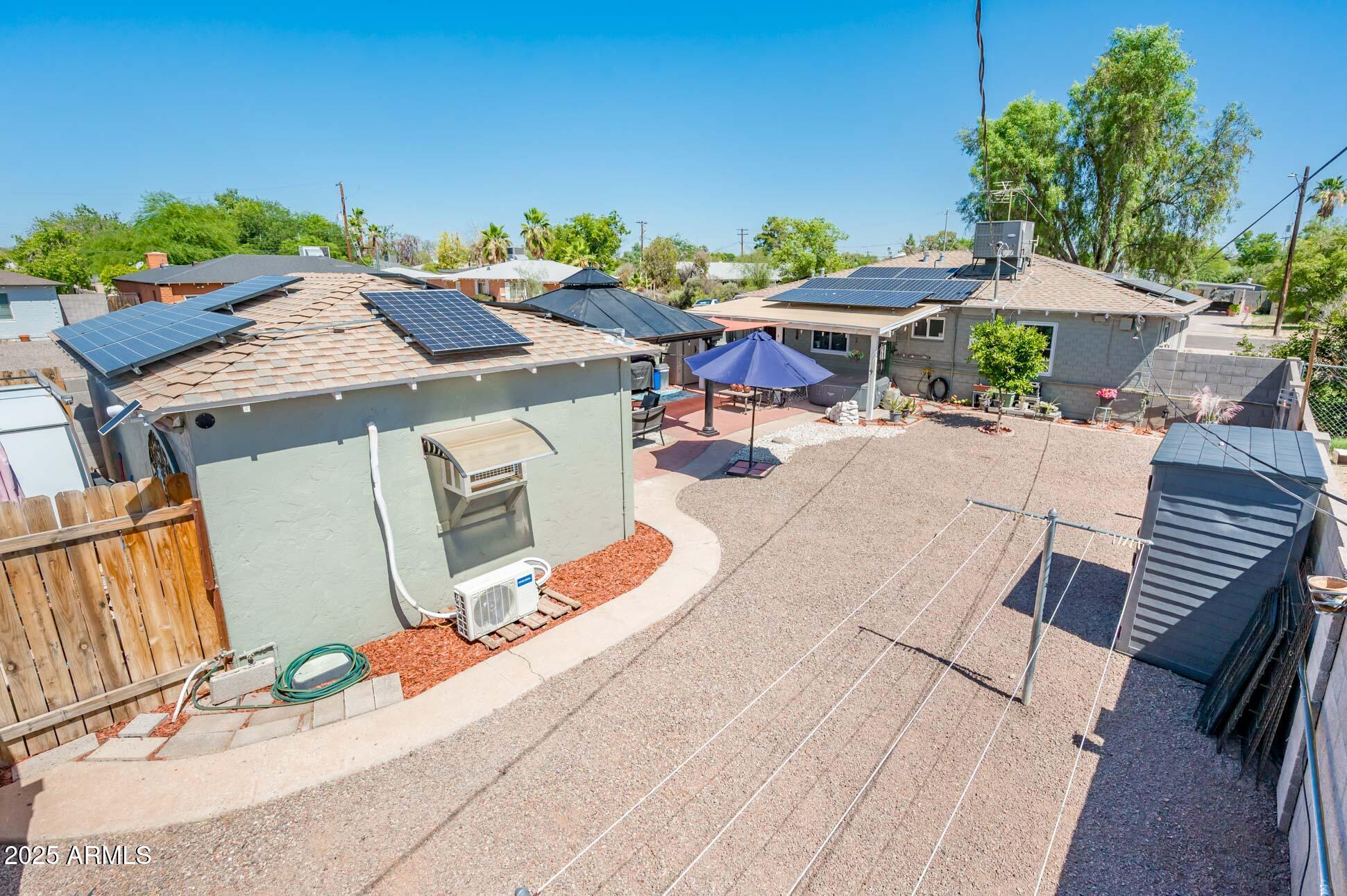 2221 West Mitchell Drive Phoenix, AZ 85015 - Photo 10 of 45 an outdoor space with furniture and umbrella