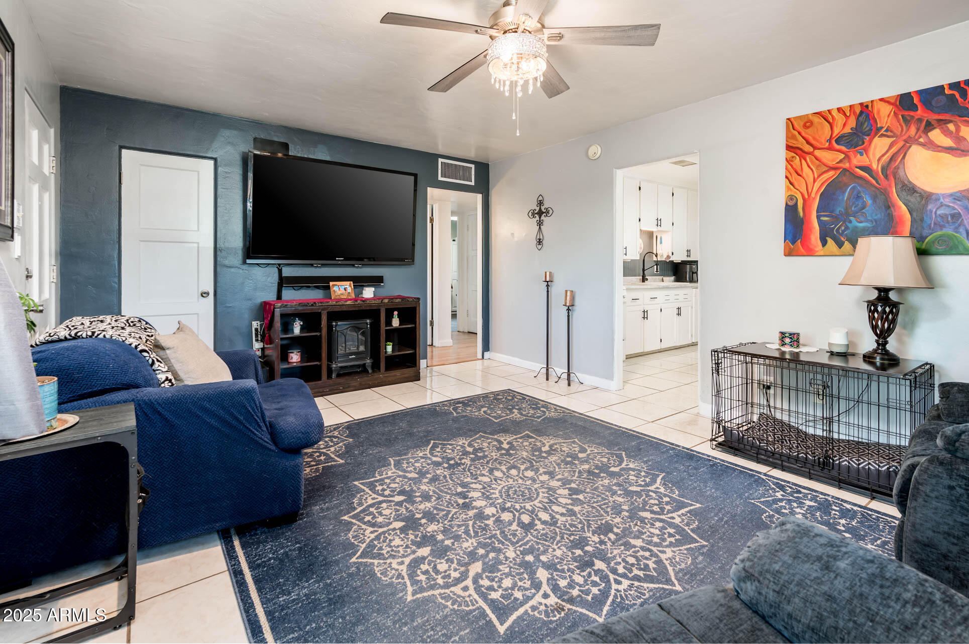 2221 West Mitchell Drive Phoenix, AZ 85015 - Photo 16 of 45 a living room with furniture and a flat screen tv