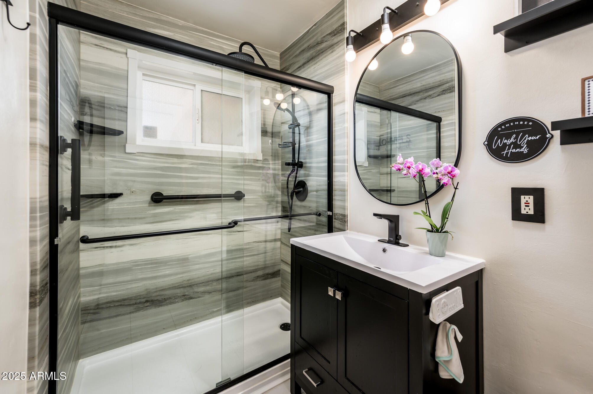 2221 West Mitchell Drive Phoenix, AZ 85015 - Photo 26 of 45 a bathroom with a sink a vanity and a mirror