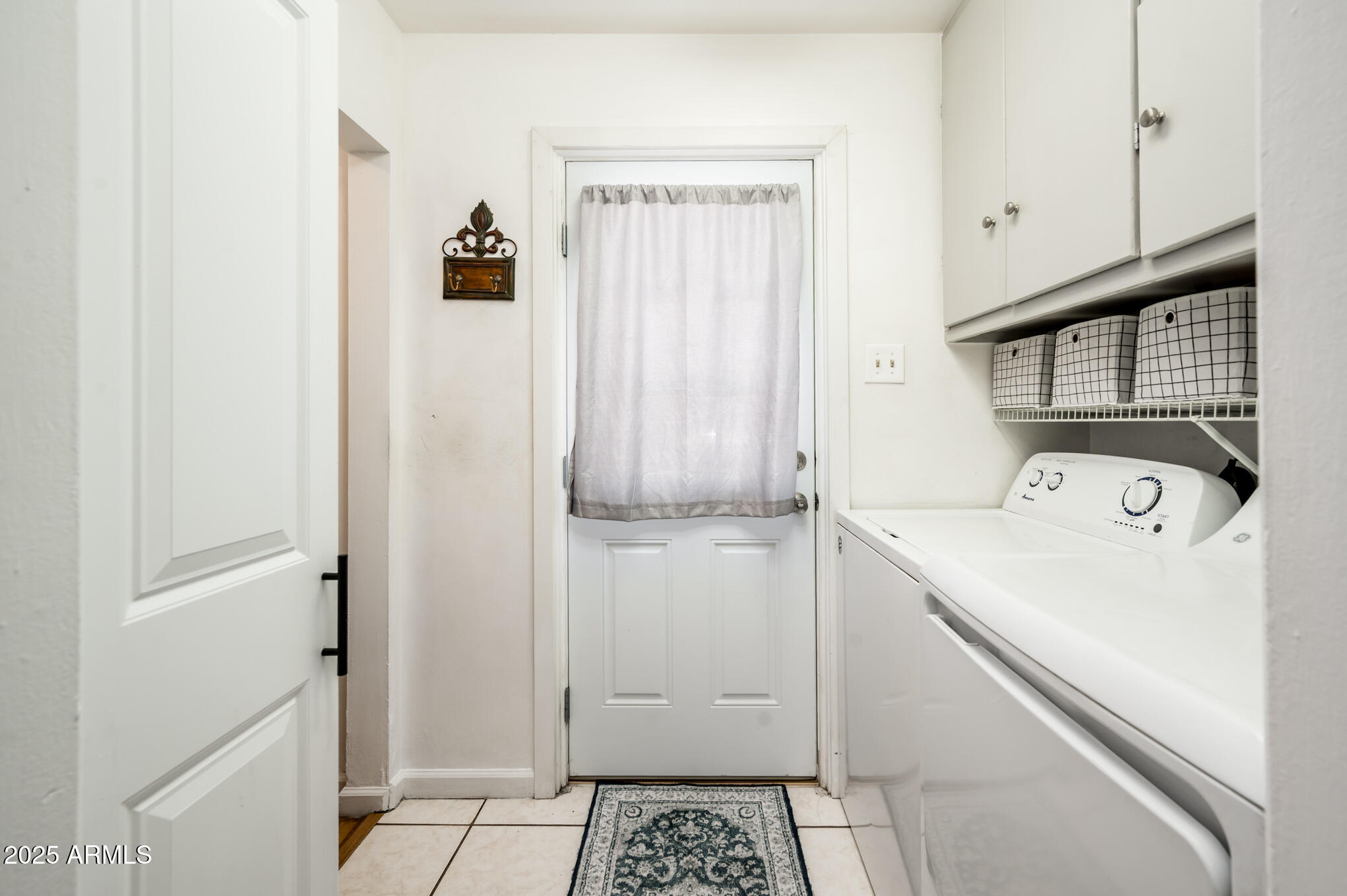 2221 West Mitchell Drive Phoenix, AZ 85015 - Photo 29 of 45 a view of storage and utility room with a washer dryer