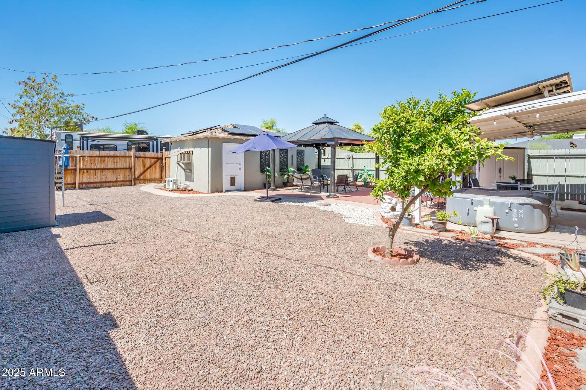 2221 West Mitchell Drive Phoenix, AZ 85015 - Photo 34 of 45 a front view of a house with a yard