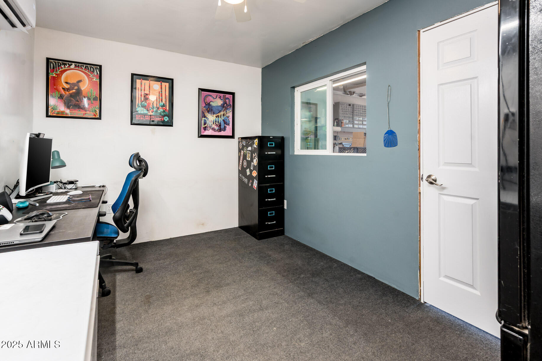 2221 West Mitchell Drive Phoenix, AZ 85015 - Photo 36 of 45 a view of a workspace with furniture and window