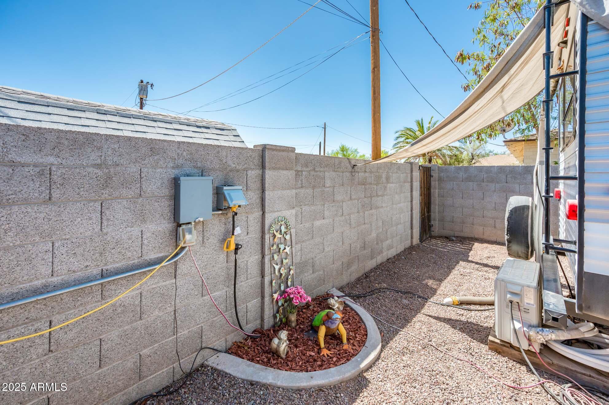 2221 West Mitchell Drive Phoenix, AZ 85015 - Photo 40 of 45 a view of a balcony with chair and potted plants