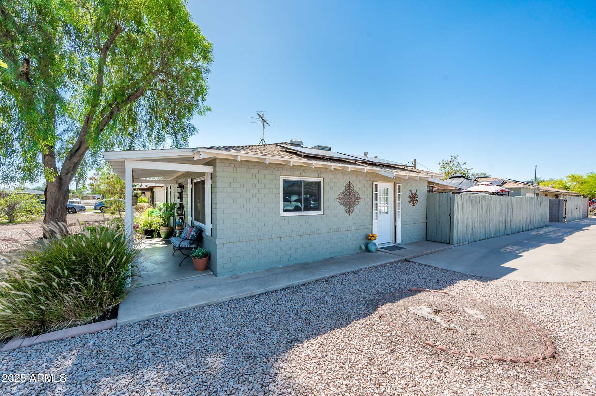 2221 West Mitchell Drive Phoenix, AZ 85015 - Photo 41 of 45 a view of a house with backyard porch and sitting area