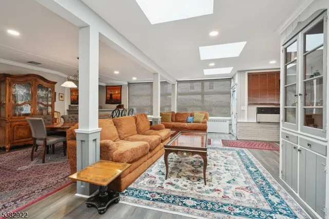 a living room with furniture and a rug
