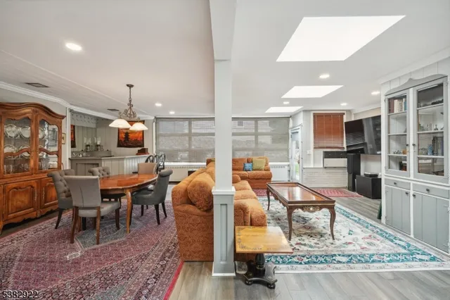 a living room with furniture a rug and a fireplace