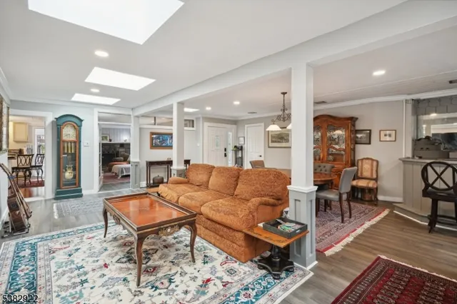 a living room with furniture and a rug