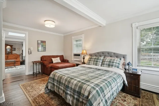 a bedroom with two beds and a couch