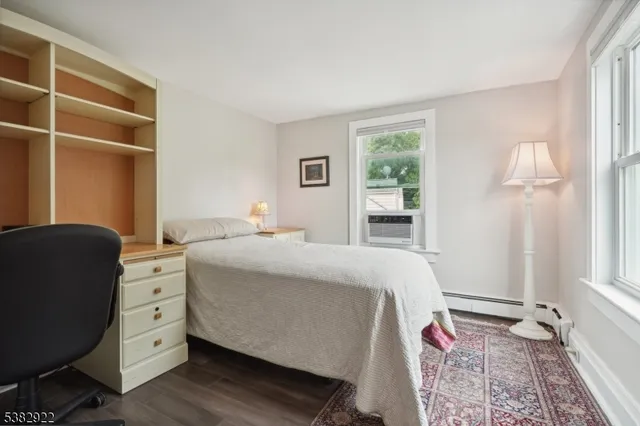 a bed room with a bed and a window