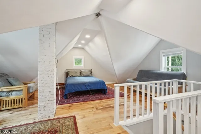 a bedroom with furniture and a window