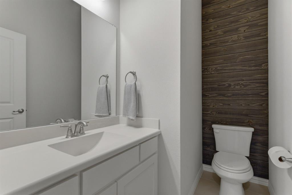 2801 Seabiscuit Road Celina, TX 75009 - Photo 24 of 39 Half bath featuring vanity and light tile patterned floors