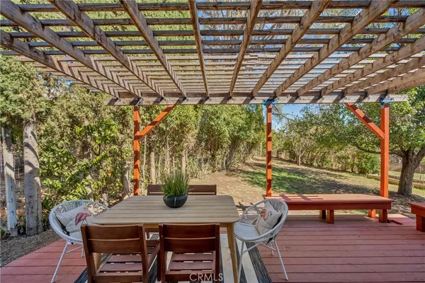 a view of a patio with wooden floor