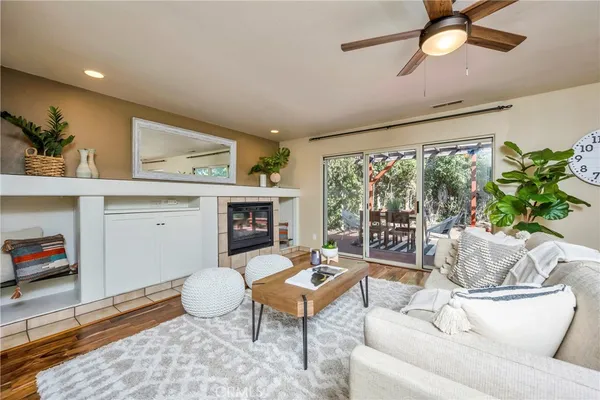 a living room with furniture and a floor to ceiling window