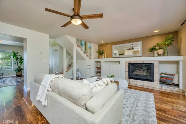 a living room with furniture and a fireplace